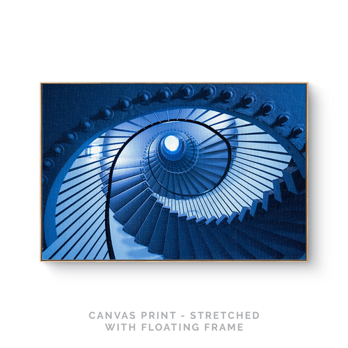 a picture of a blue spiral staircase with text that reads canvas print - stretched with