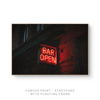a red neon sign that reads bar open