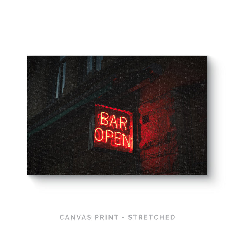 a red neon sign that says bar open