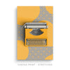 a yellow typewriter sitting on top of a yellow book