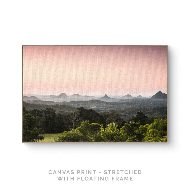 a picture of a mountain range with a pink sky